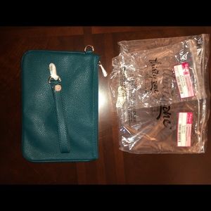 Teal clutch with wrist strap. NWT